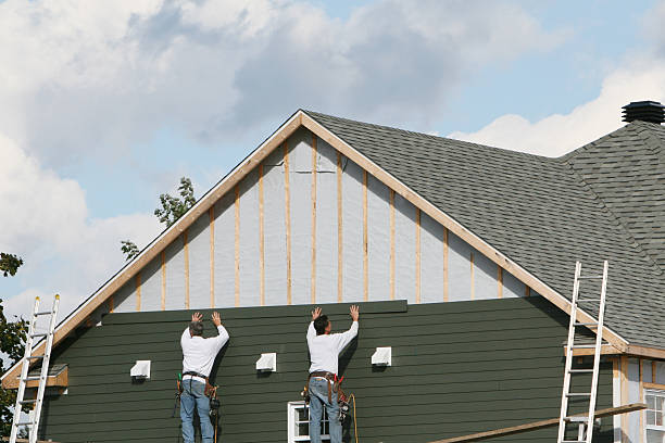 Professional Siding Replacement technician working in Louisville, OH